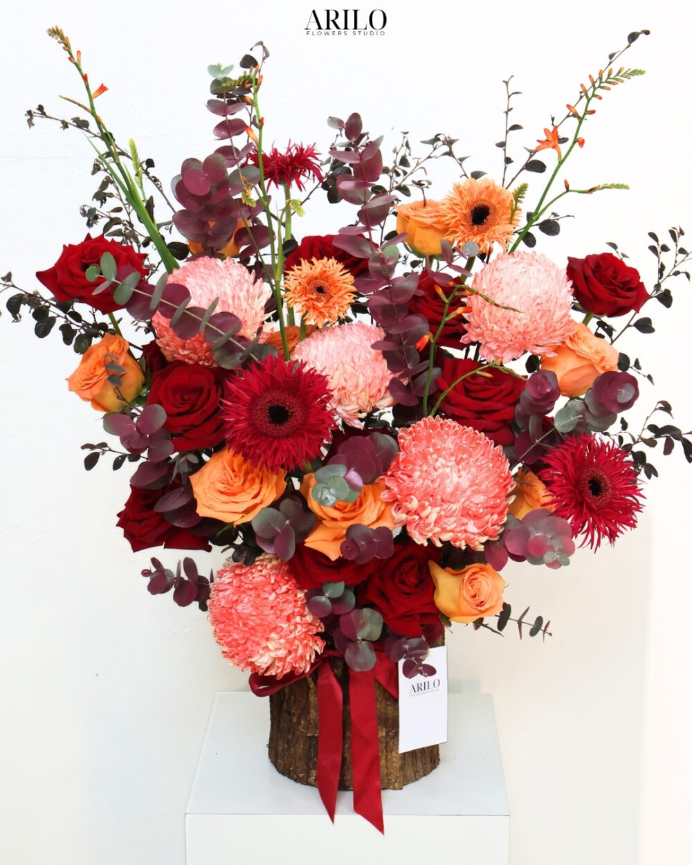 LẴNG HOA CHÚC MỪNG SẮC ĐỎ CAM HIỆN ĐẠI NỔI BẬT TINH TẾ VÀ ĐẦY CẢM XÚC G57